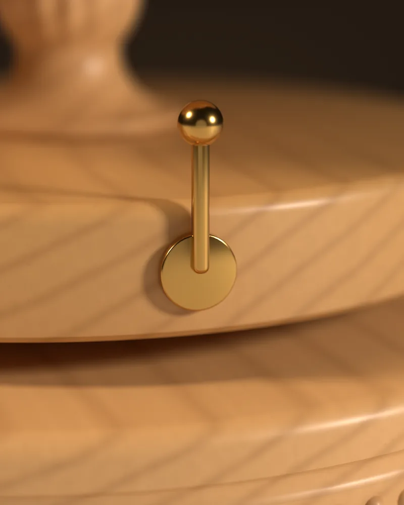 Close-up of the small stop lever on the right of the base